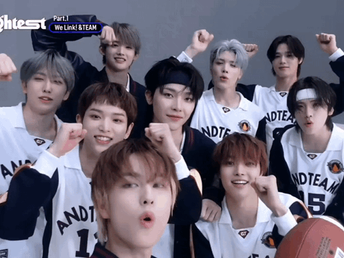 A Group Of Young Men Are Posing For A Picture And One Of Them Has The Number 1 On His Shirt GIF