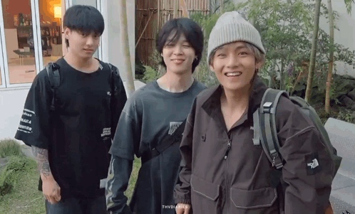 A Group Of Young Men Are Posing For A Picture And One Of Them Is Wearing A North Face Jacket GIF