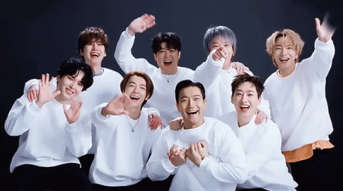 A Group Of Young Men Are Posing For A Picture Together GIF