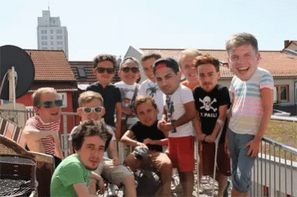 a group of young men are posing for a picture with one wearing a shirt that says pauli