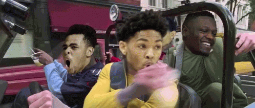 A Group Of Young Men Are Riding In A Car With Their Mouths Open . GIF