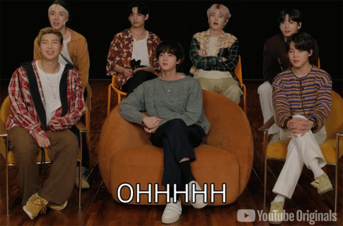 A Group Of Young Men Are Sitting In Chairs And One Of Them Is Sitting On A Bean Bag Chair And Says Ohhhhh GIF