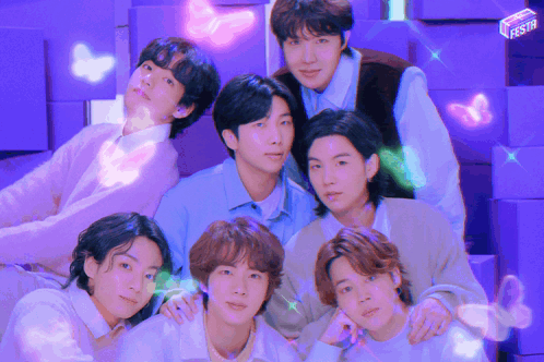 A Group Of Young Men Posing For A Picture With A Purple Background GIF