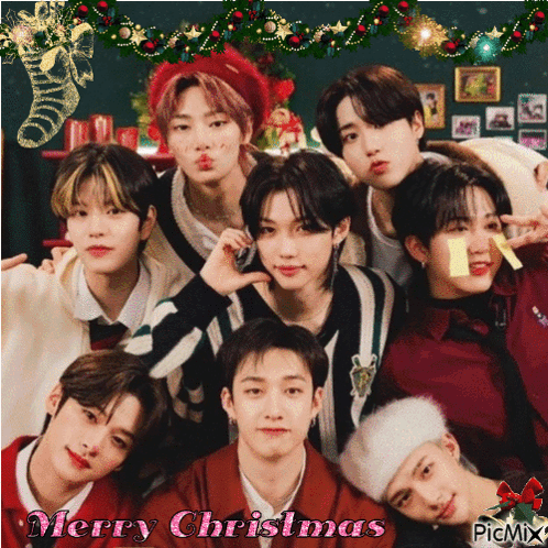 A Group Of Young Men Posing For A Picture With The Words Merry Christmas Written On The Bottom GIF