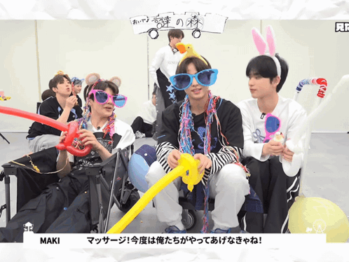 a group of young men wearing sunglasses and bunny ears are sitting next to each other with maki written on the bottom ri