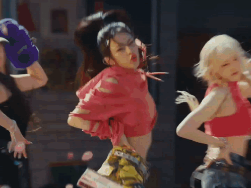A Group Of Young Women Are Dancing In Front Of A Record Shop GIF