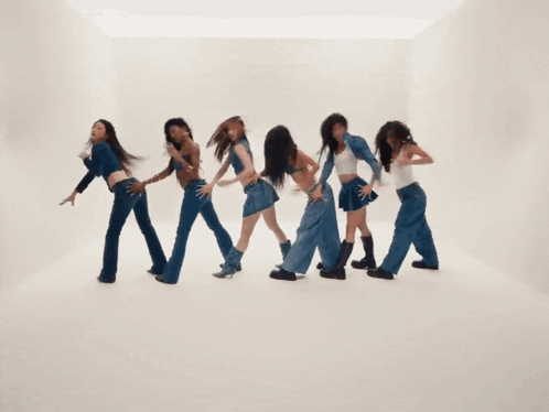 A Group Of Young Women Are Dancing Together And One Of Them Is Wearing A White Tank Top GIF