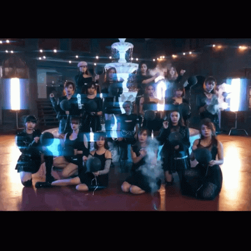 A Group Of Young Women Are Posing For A Picture In Front Of A Pyramid GIF