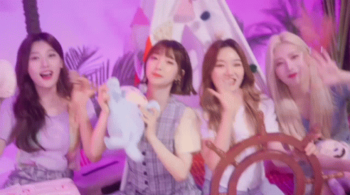 A Group Of Young Women Are Standing Next To Each Other In A Room With A Tent . GIF