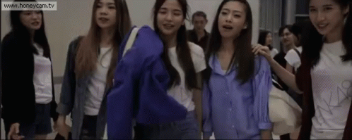 A Group Of Young Women Are Standing Next To Each Other With The Website Www.honeycam.tv At The Bottom GIF