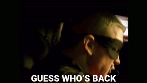 A Guess Who 'S Back Poster With A Man And A Child In The Background GIF