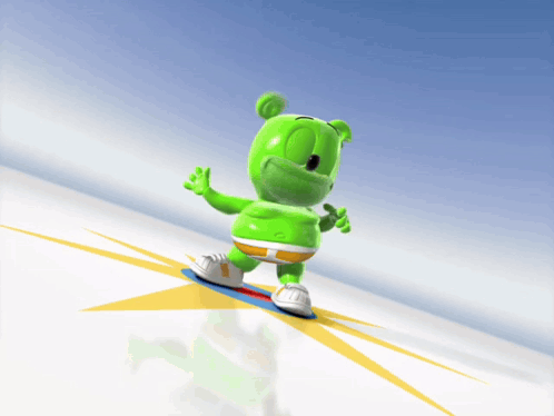 A Gummy Bear Is Riding A Snowboard Down A Hill GIF