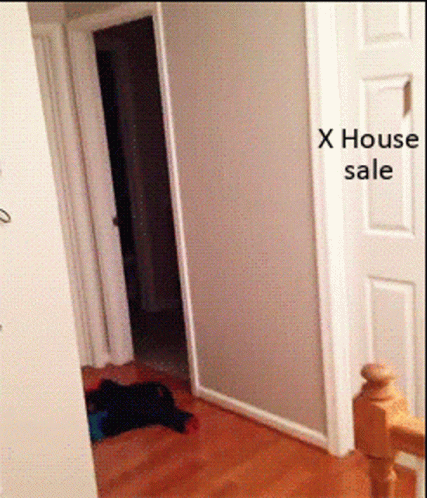 A Hallway With A Sign That Says X House Sale On It GIF
