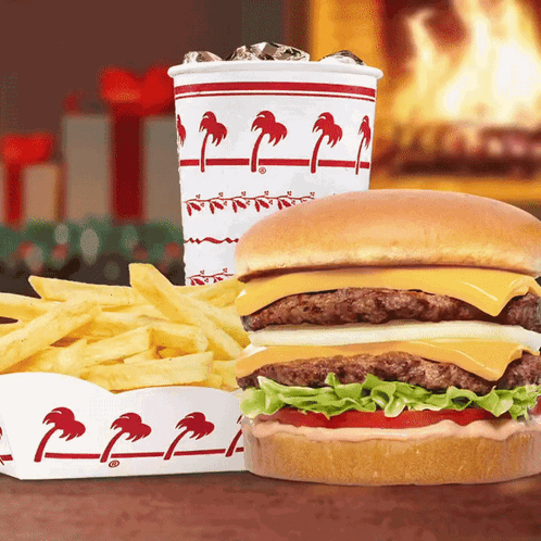 A Hamburger And French Fries Next To A Cup That Says ' In N Out ' GIF