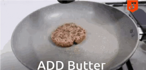 A Hamburger Patty Is Being Cooked In A Frying Pan With The Words " Add Butter " Below It GIF