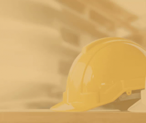 A Hand Holding A Hard Hat With A Hammer And A City In The Background GIF