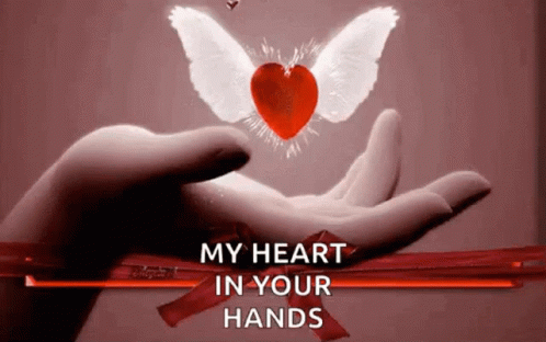 A Hand Holding A Heart With Wings And The Words " My Heart In Your Hands " Below It GIF