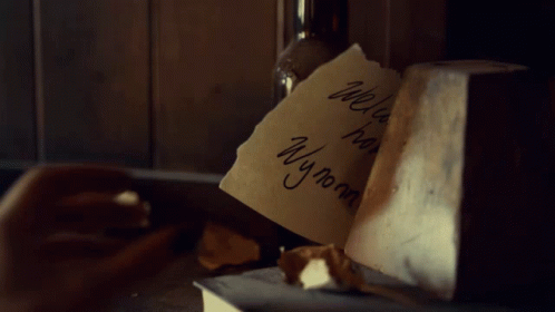 A Hand Holding A Piece Of Paper That Says Welcome Home Wyonna GIF