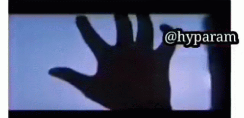 A Hand Is Casting A Shadow On A Screen With The Words @Hyparam Above It GIF