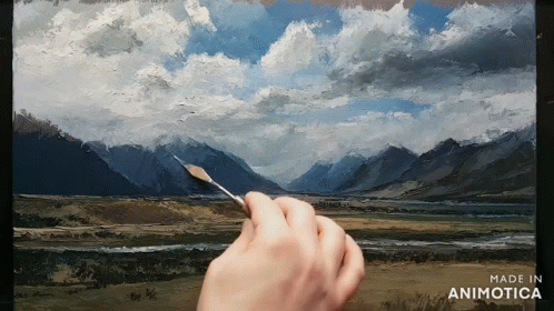 a hand is holding a brush in front of a painting that says made in animonica