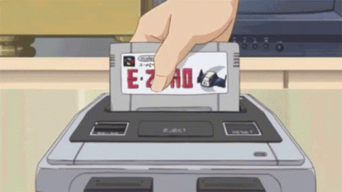 A Hand Is Holding A Cartridge That Says E-7 Ad GIF