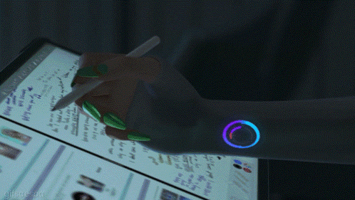a hand is holding a pen in front of a computer screen that says " search "