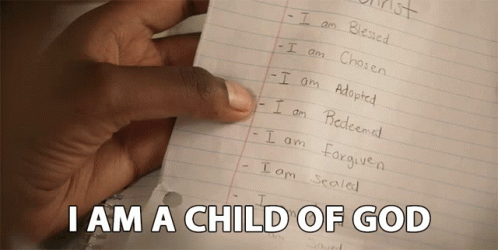A Hand Is Holding A Piece Of Paper With The Words I Am A Child Of God On It GIF