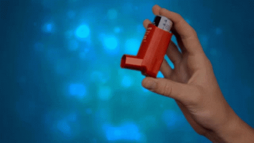 A Hand Is Holding A Red Inhaler With The Number 4 On It GIF