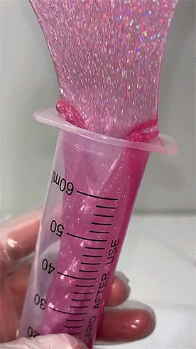 A Hand Is Holding A Syringe That Says 60Ml GIF