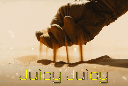 A Hand Is Holding Sand And The Words Juicy Juicy Are Written Below It GIF