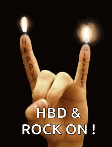 A Hand Is Making A Rock And Roll Sign With Candles On It . GIF