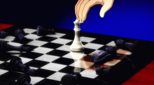 A Hand Is Playing A Game Of Chess With A White King On The Board GIF