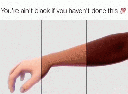 a hand is touching a person 's arm with a tattoo on it .