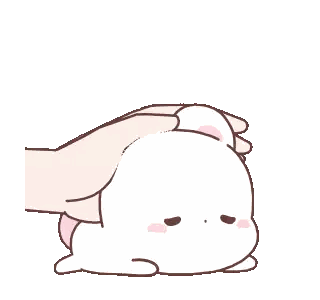 a hand is touching the head of a rabbit