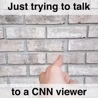A Hand Pointing At A Brick Wall With The Words Just Trying To Talk To A Cnn Viewer GIF