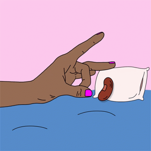 A Hand With Pink Nails Is Reaching For A Pillow With A Sausage On It GIF