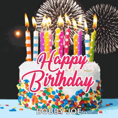 A Happy Birthday Cake With Candles And Fireworks In The Background . GIF