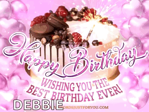 A Happy Birthday Card For Debbie With A Cake GIF