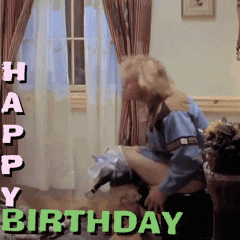 A Happy Birthday Greeting With A Man Holding A Woman 'S Leg GIF