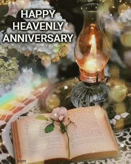 a happy heavenly anniversary greeting card with a book and a candle