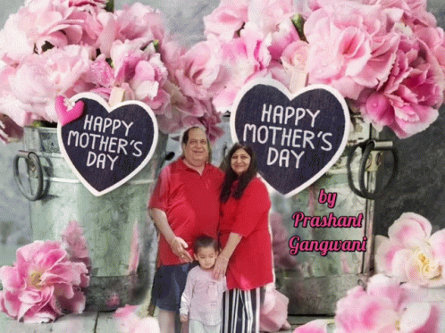 A Happy Mother 'S Day Greeting Card With A Family Standing In Front Of Pink Flowers GIF