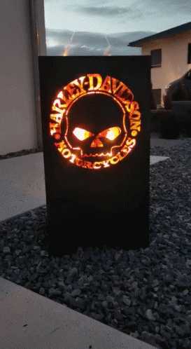 A Harley Davidson Motorcycles Sign Is Lit Up GIF