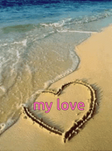 A Heart Drawn In The Sand With The Words " My Love " Written In Pink GIF