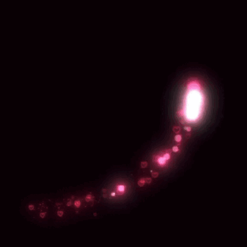 A Heart Made Of Pink Lights And Hearts On A Dark Background GIF