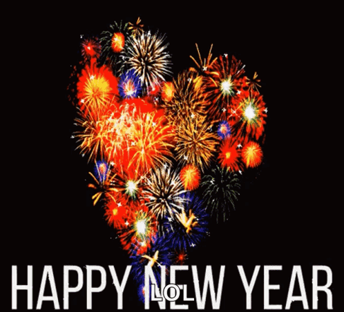 A Heart Shaped Fireworks Display With The Words Happy New Year Written Below It GIF