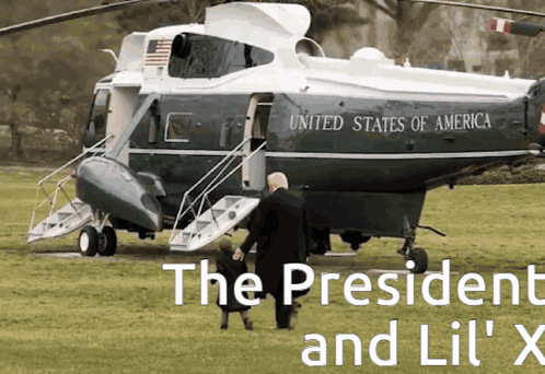 a helicopter from the united states of america is parked in a grassy field