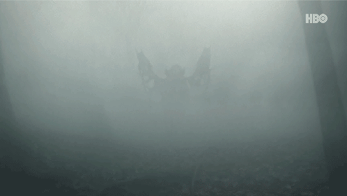 A Helicopter Is Flying Through A Foggy Forest With The Hbo Logo In The Background . GIF