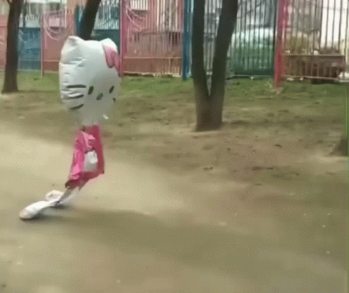 A Hello Kitty Shaped Balloon Is Flying Through The Air GIF