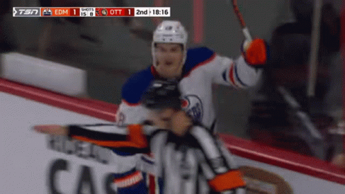 A Hockey Game Between Edmonton Oilers And Calgary Canucks GIF