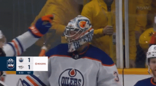A Hockey Game Is Being Played Between The Oilers And Rogers GIF